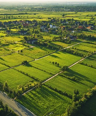 aerial-view-farmland-rural-village-sunset-green-fields-agricultural-land-use-count (1)
